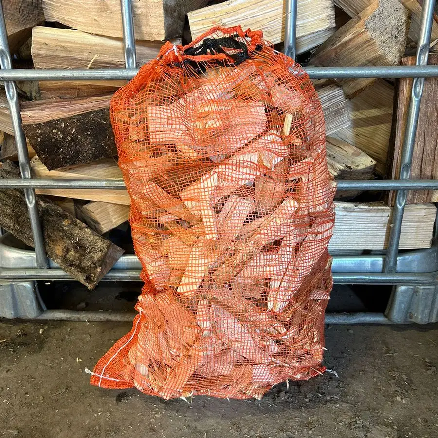 Net bag of dry kindling wood, ready to burn